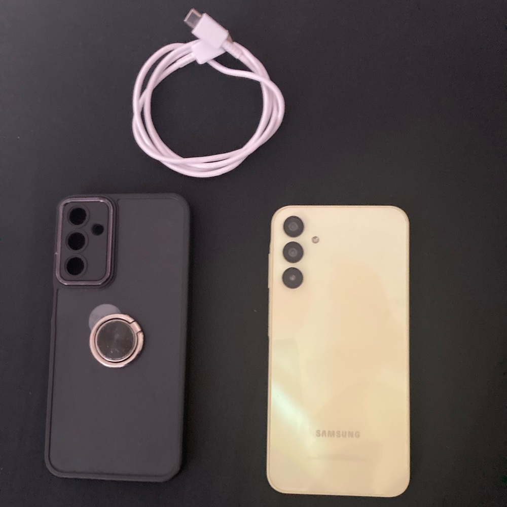 Samsung Yellow Smartphone with Black Case and White Cable